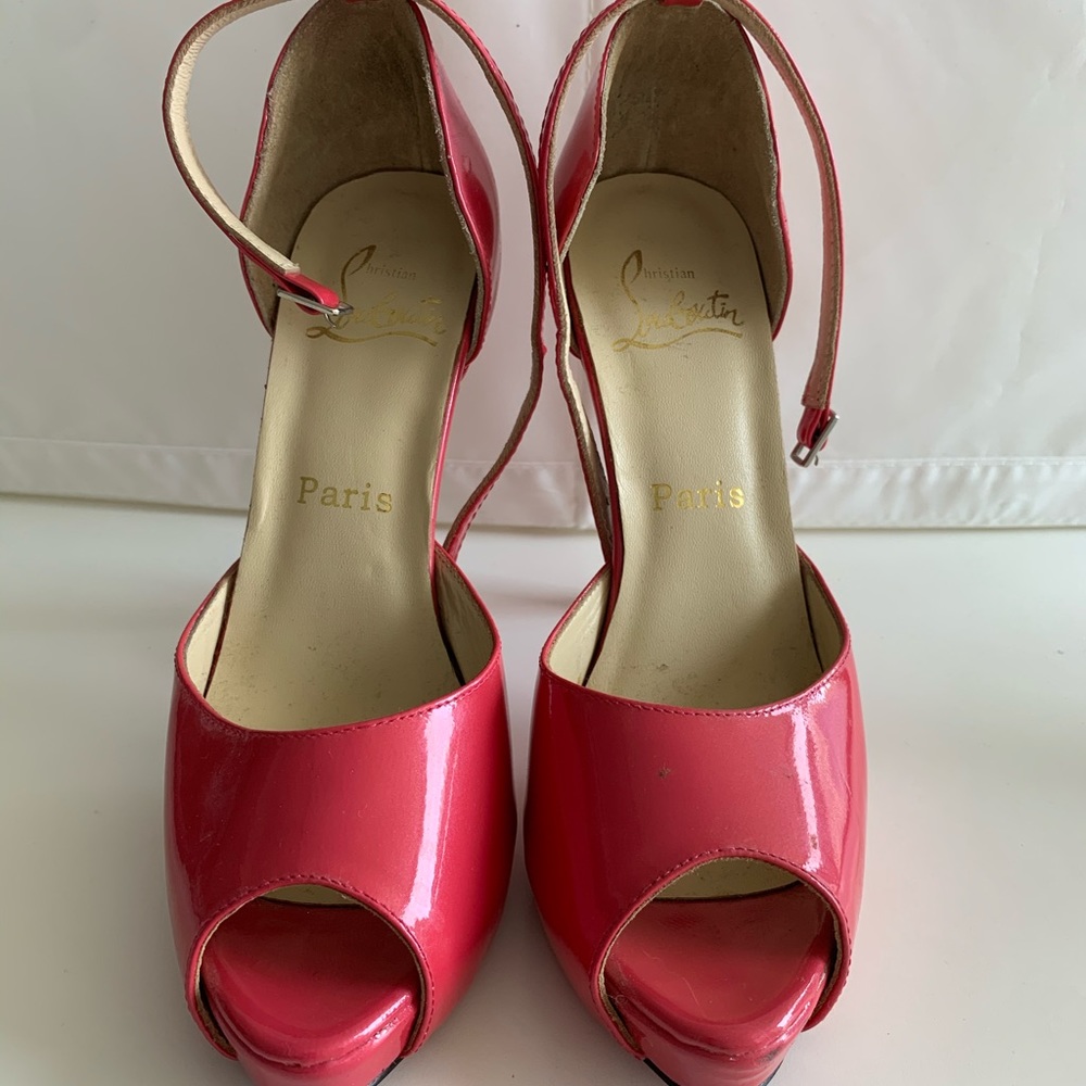 Hot pink Loubotin peep toe shoes